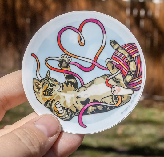 Cat Playing with Lesbian Flag Colors Yarn - Pride Sticker